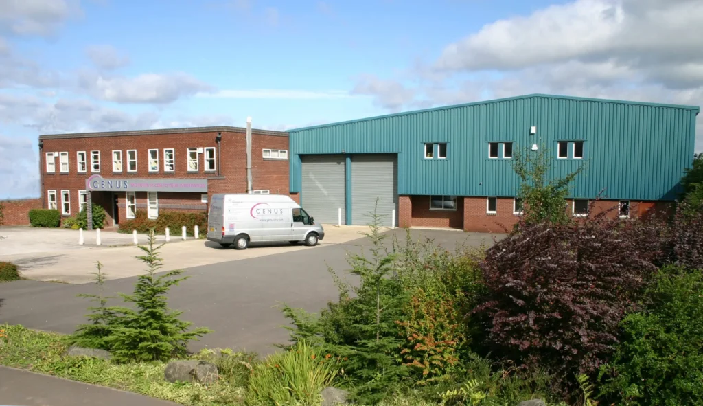 A photograph of the genus building from the outside on a sunny day.