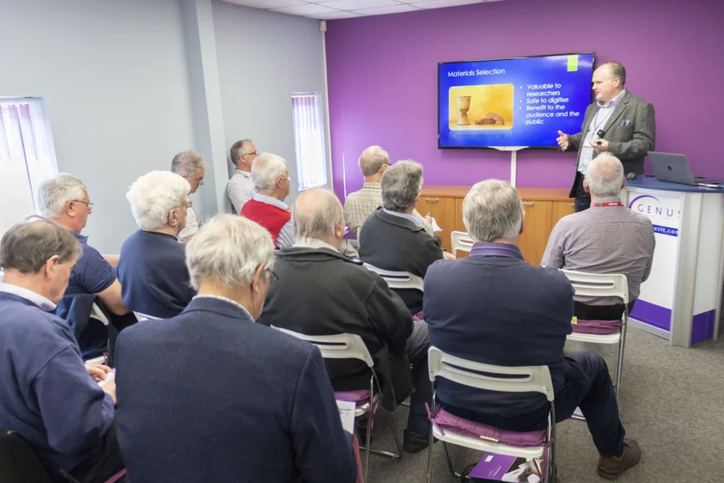 A photograph of a presentation being given in front of an audience.