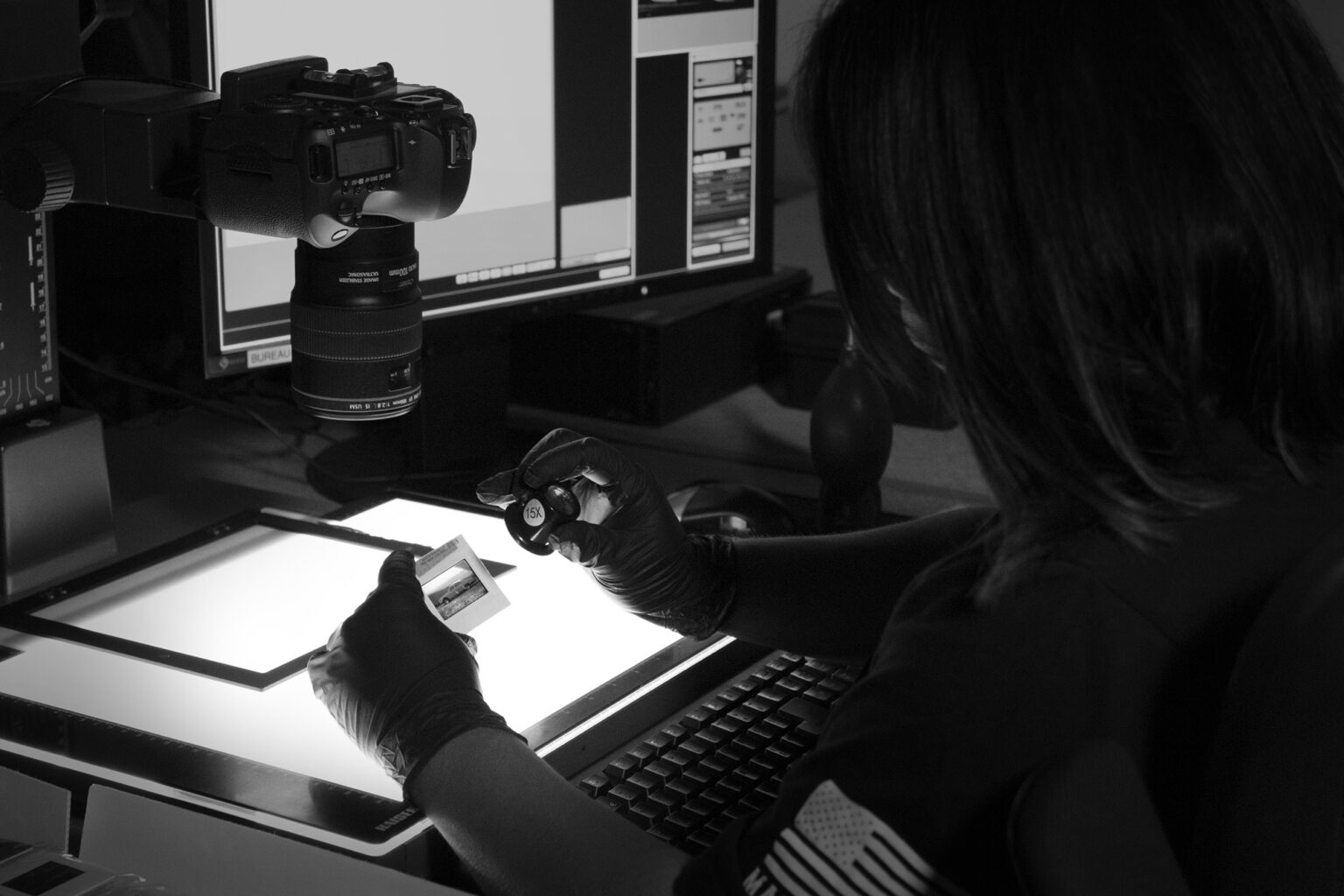 A photograph of a 35mm negative on a lightbox in preparation for capture