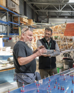 Dave Oxley talks Chris Elwell through some of the Hurricane construction techniques.